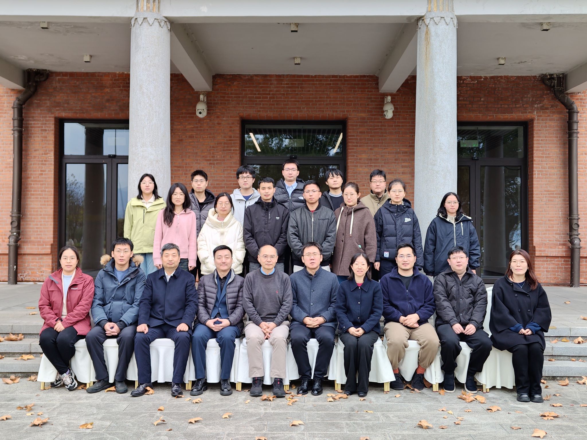 A group of people posing for a photo AI-generated content may be incorrect.